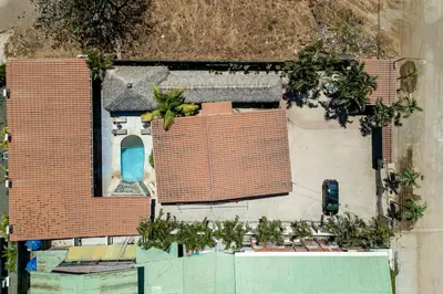 an aerial view of a house with a roof at Cozy Seaside Studio Perfect for Families in Playa Grande