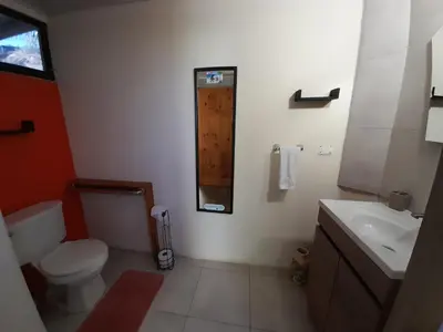 a bathroom with a toilet and a sink at BeachBungalow Surf&Stay in Patos
