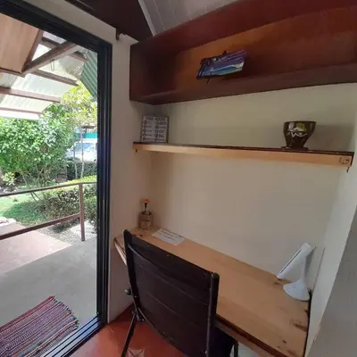 a home office with a desk and a window at BeachBungalow Surf&Stay in Patos