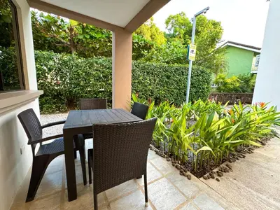 a black table and chairs on a patio at Casa Limonada Ground Condo in Coco