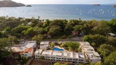 an aerial view of a resort and the ocean at The Nest 2 bedroom1 bath Condo Rooftop patio in Coco