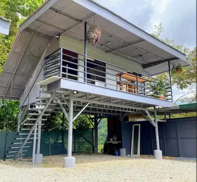 a house with a staircase up to the roof at CANTO DEL RIO-Rivas- vista a la montaña- tranquilo in Rivas