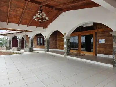 an outdoor patio with a wooden ceiling and wooden doors at Casona Cocobolo el mejor lugar de Costa Rica in Guanacaste
