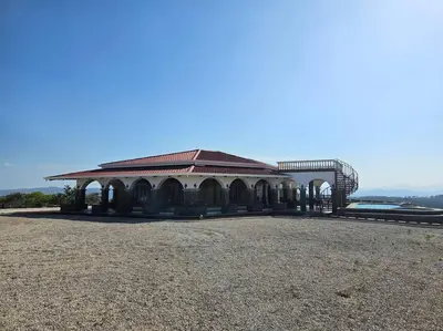 a large building with a roof on top of a field at Casona Cocobolo el mejor lugar de Costa Rica in Guanacaste