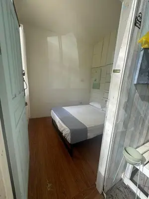 a small bedroom with a bed in a room at Hostel Los Pargos in Río Sequito