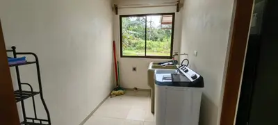 a bathroom with a sink and a window at Casita el Corral in Nuevo Arenal
