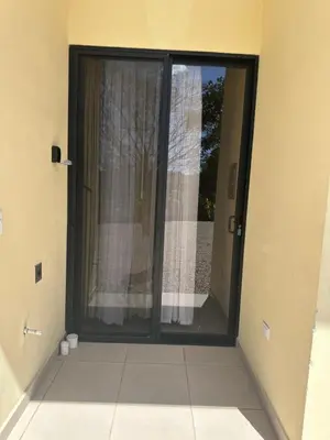 an open door to a room with a window at La Laguna in Nosara