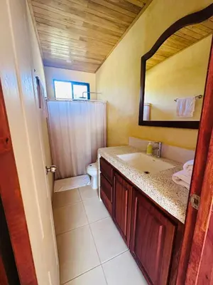 a bathroom with a sink and a mirror at La Laguna in Nosara