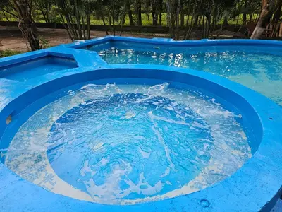 a large blue pool with water in it at Hotel Luna Liberiana in Liberia