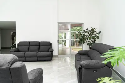 a living room with two couches and a couch at Home 333 Habitacion 331 in Escazu