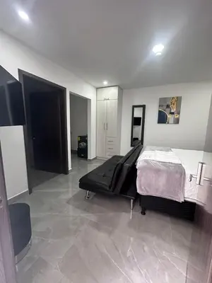 a bedroom with a bed in the middle of a room at Home 333 Habitacion 331 in Escazu