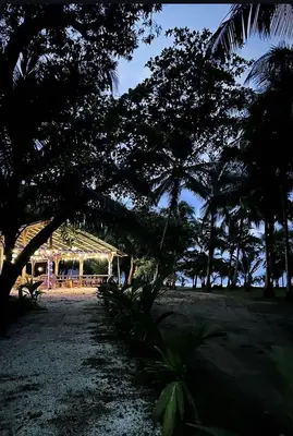 a group of trees in front of a building at Villa Ho Omaika I Los Delfines Tambor in Pochote