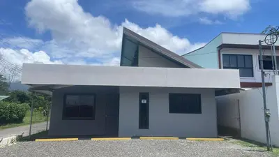 a house with a blue and white at La Fortuna Raft House in Fortuna