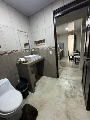 a bathroom with a toilet and a sink at La Fortuna Raft House in Fortuna