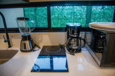 two blenders sitting on a counter next to a window at Scenic Volcano Villas with Hot Tub in Fortuna