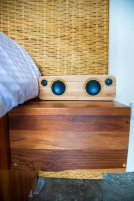 a wooden bed with two speakers on top of it at Scenic Volcano Villas with Hot Tub in Fortuna