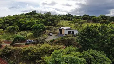an aerial view of a small house on a hill at Nambí Monteverde in Monteverde Costa Rica