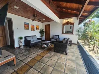 a living room with furniture and a ceiling at Villa Tucán - La Fortuna in Fortuna