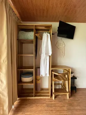 a room with a bunk bed with a ladder and a chair at Villa deluxe, jacuzzi, cocina in Fortuna