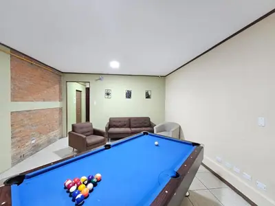 a billiard room with a pool table in a house at Hostel La Cali Inn in San José