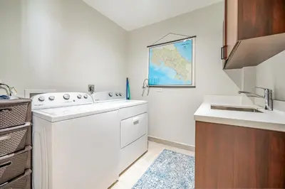 a kitchen with a sink and a dishwasher at Golden Palms#10 in Playa Flamingo