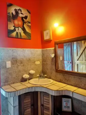 a bathroom with a sink and a mirror at Casa Macondo 3 bdrm w private pool, close to beach, Esterillos Oeste in Esterillos Este