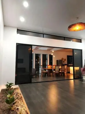 a living room with a dining room and a dining table at Villa Luxury Volcano Paradise Retreat in Fortuna