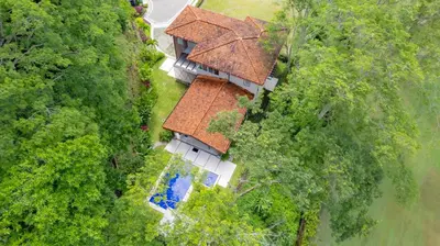 an overhead view of a house with a roof at Casa Forest 4 bdrs private pool in Los Suenos in Herradura