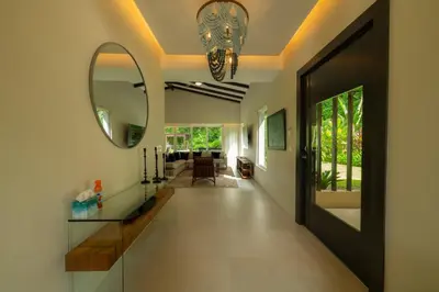 a hallway of a home with a mirror at Casa Forest 4 bdrs private pool in Los Suenos in Herradura