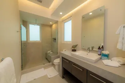 a bathroom with a sink and a shower and a toilet at Casa Forest 4 bdrs private pool in Los Suenos in Herradura