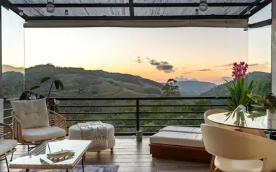 a living room with a view of a mountain at Yaloco House Monteverde in Monteverde Costa Rica