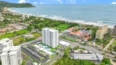 an aerial view of a city and the ocean at Incredible Views - Brand-New 3BR Condo in Jacó