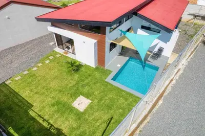 an overhead view of a house with a yard with a swimming pool at Casa Maiki Your Private Retreat in Uvita Center in Uvita