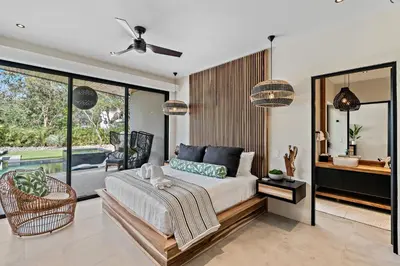a bedroom with a bed and a balcony at Casa Ola Aloha in Playa Avellana
