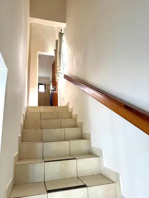 a staircase in a house with white walls at Coco Maya 2b2b Villa in Coco