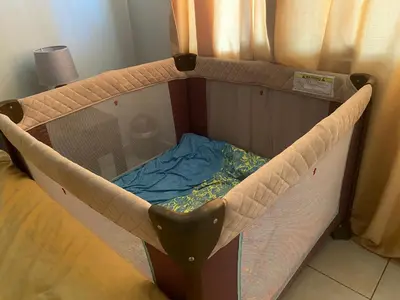 a small bed in a room with a cot at Coco Maya 2b2b Villa in Coco