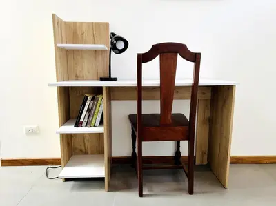 a wooden desk with a chair next to a book shelf at Casa Kiv Turrialba Centro in Turrialba