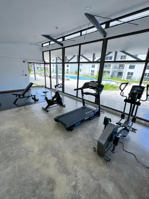 a gym with several exercise bikes in a room at Luxury Condo at Viva Jaco Residence in Jacó