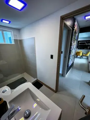 a bathroom with a white tub and a sink at Luxury Condo at Viva Jaco Residence in Jacó