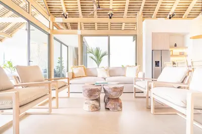 a living room with white furniture and windows at Casa Frenchie & Villas Vista del Mar - by Pura Villas in Dominicalito