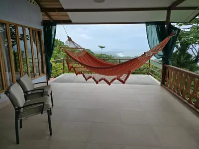 a hammock on the balcony of a house at LiS house in San Luis