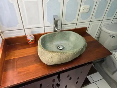 a bathroom with a stone sink on a wooden counter at LiS house in San Luis