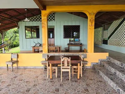 a wooden table and chairs on a patio at LiS house in San Luis