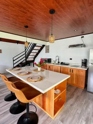 a kitchen with a large island in the middle at Alma Vida Lofts in Fortuna