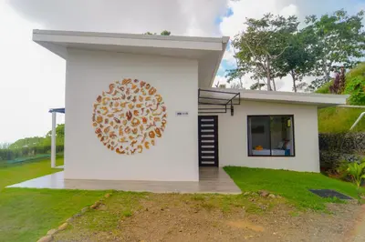 a house with a painting on the side of it at 3bdr House in Uvita LAPA Ocean View in Uvita