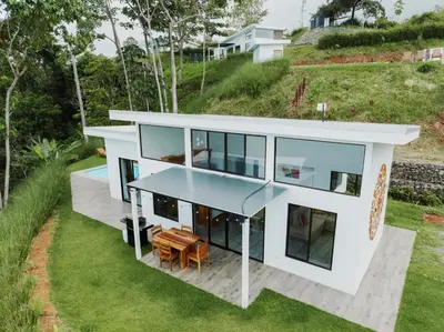 an aerial view of a house with glass windows at 3bdr House in Uvita LAPA Ocean View in Uvita