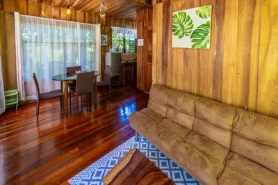 a living room with a couch and a table at Rustic Treehouse Monteverde in Monteverde Costa Rica