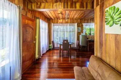 a living room with a couch and a table at Rustic Treehouse Monteverde in Monteverde Costa Rica
