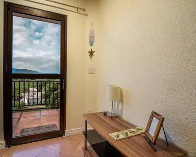 a room with a desk and a door with a window at Casa Bella Vista Jaco #1 in Jacó