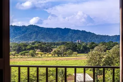 a view of a mountain from a window at Casa Bella Vista Jaco #1 in Jacó